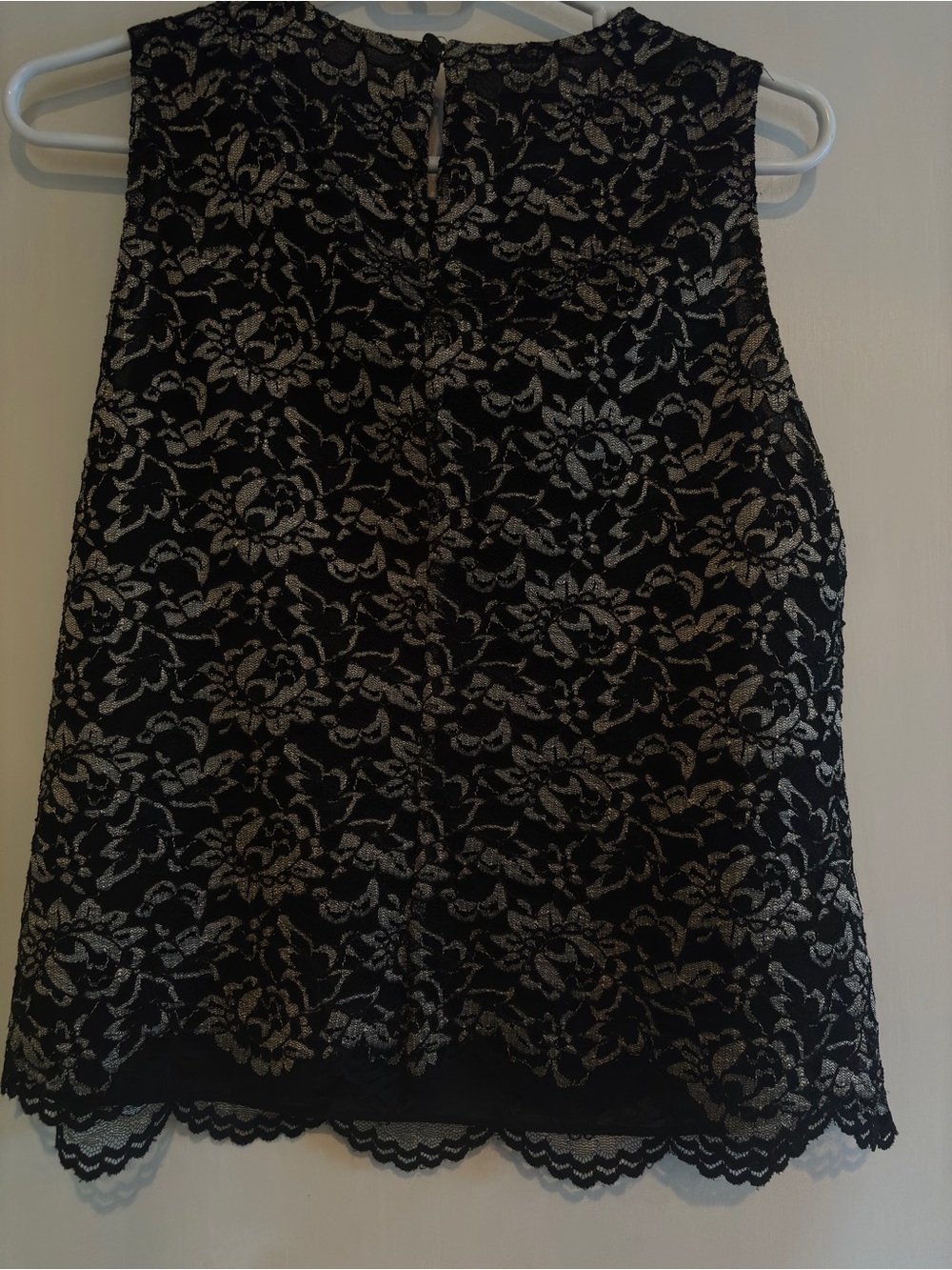 Black Lace Sleeveless Floral Top with a covered button at the top on the back.